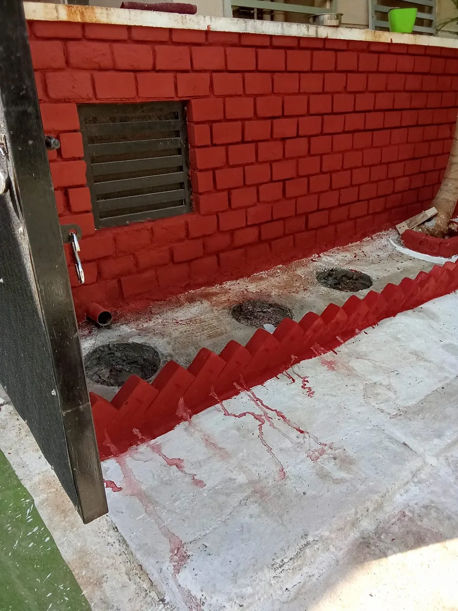 Finished brick wall with a concrete floor and painted surface