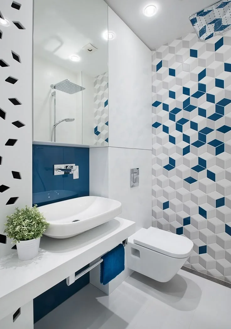 Bathroom finished with a geometric blue and white feature tile wall